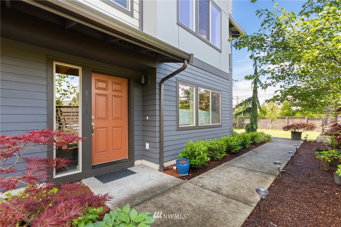 4514 Northeast 3rd Lane Renton, WA 98059 - Photo 2 of 22 a bunch of flowers in front of the house
