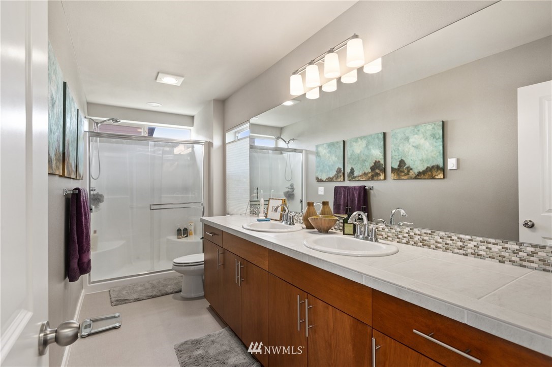 4514 Northeast 3rd Lane Renton, WA 98059 - Photo 12 of 22 a bathroom with a sink a toilet and shower