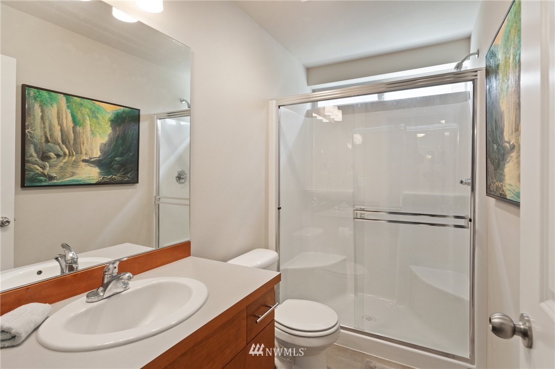 4514 Northeast 3rd Lane Renton, WA 98059 - Photo 14 of 22 a bathroom with a sink toilet and shower