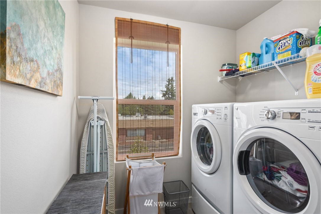 4514 Northeast 3rd Lane Renton, WA 98059 - Photo 17 of 22 a view of a hallway with washer and dryer