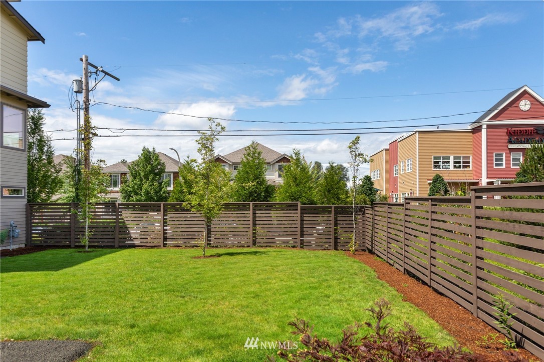 4514 Northeast 3rd Lane Renton, WA 98059 - Photo 18 of 22 a view of a backyard with a wooden fence