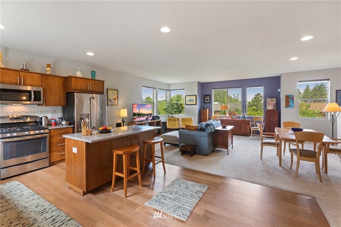 4514 Northeast 3rd Lane Renton, WA 98059 - Photo 3 of 22 a large kitchen with a table and chairs in it
