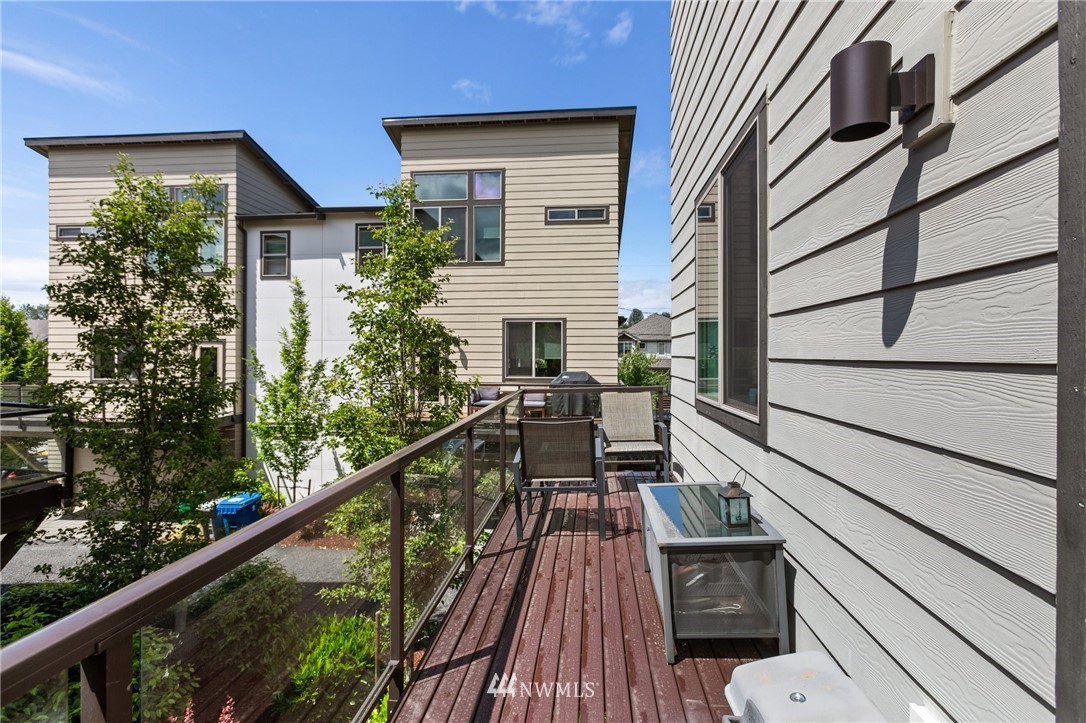 4514 Northeast 3rd Lane Renton, WA 98059 - Photo 21 of 22 a view of balcony with wooden floor and fence