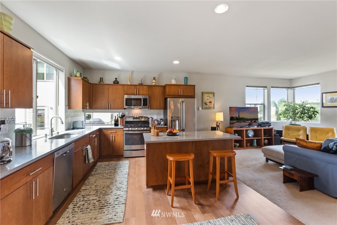 4514 Northeast 3rd Lane Renton, WA 98059 - Photo 7 of 22 a large kitchen with cabinets table and chairs