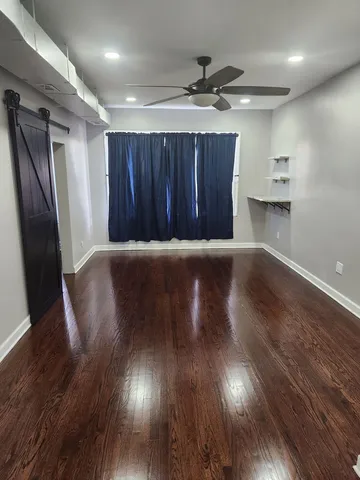 an empty room with wooden floor