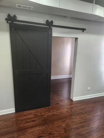 an empty room with wooden floor