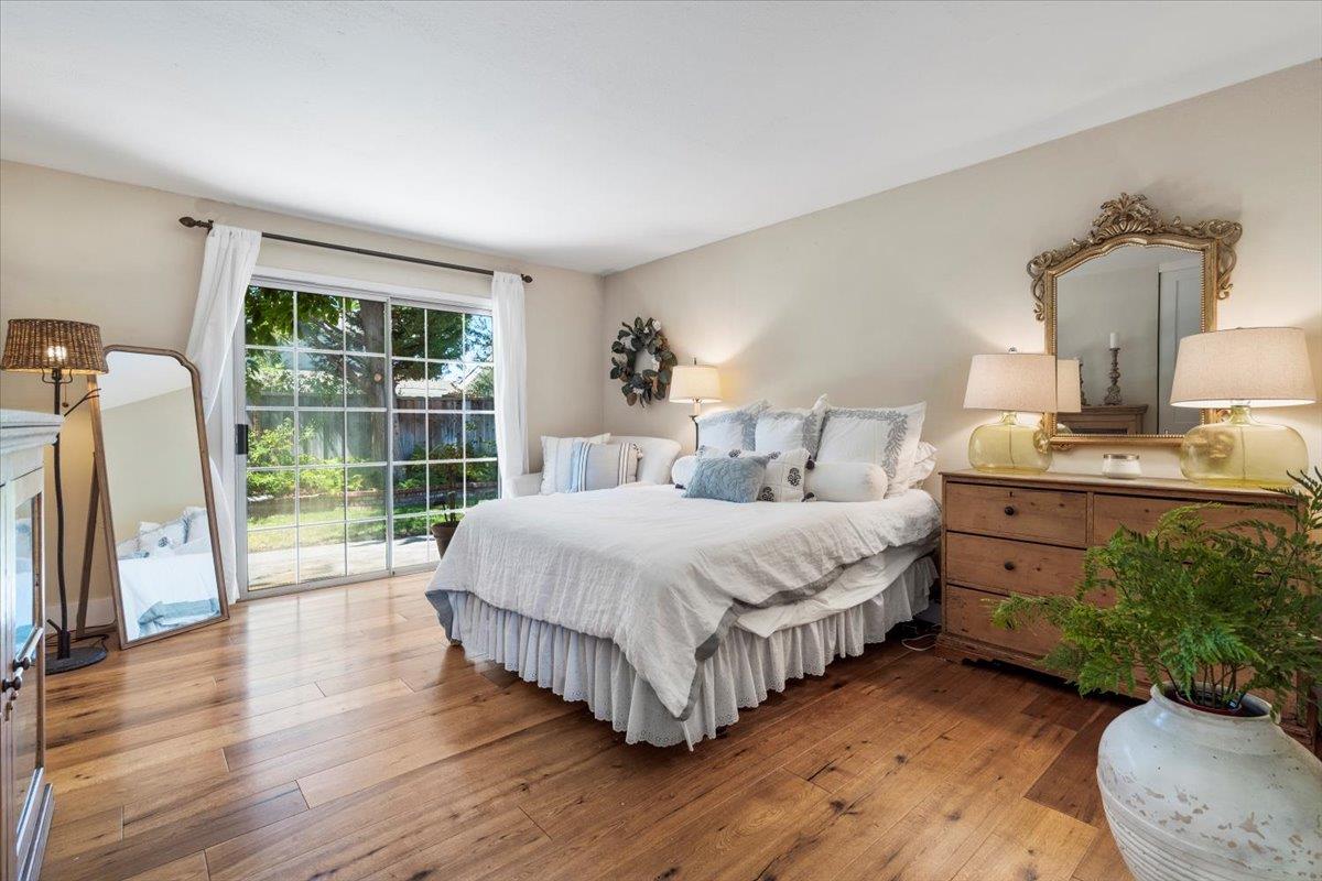2732 Doverton Square Mountain View, CA 94040 - Photo 20 of 30 a spacious bedroom with a bed and a wooden floor