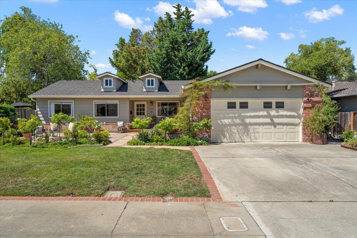 2732 Doverton Square Mountain View, CA 94040 - Photo 2 of 30 a front view of a house with a yard and garage