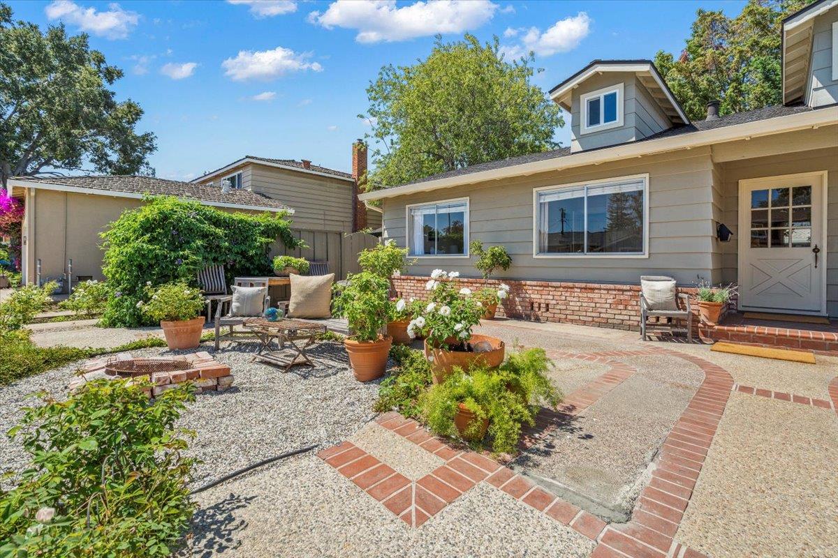 2732 Doverton Square Mountain View, CA 94040 - Photo 26 of 30 a front view of a house with a yard and a garden