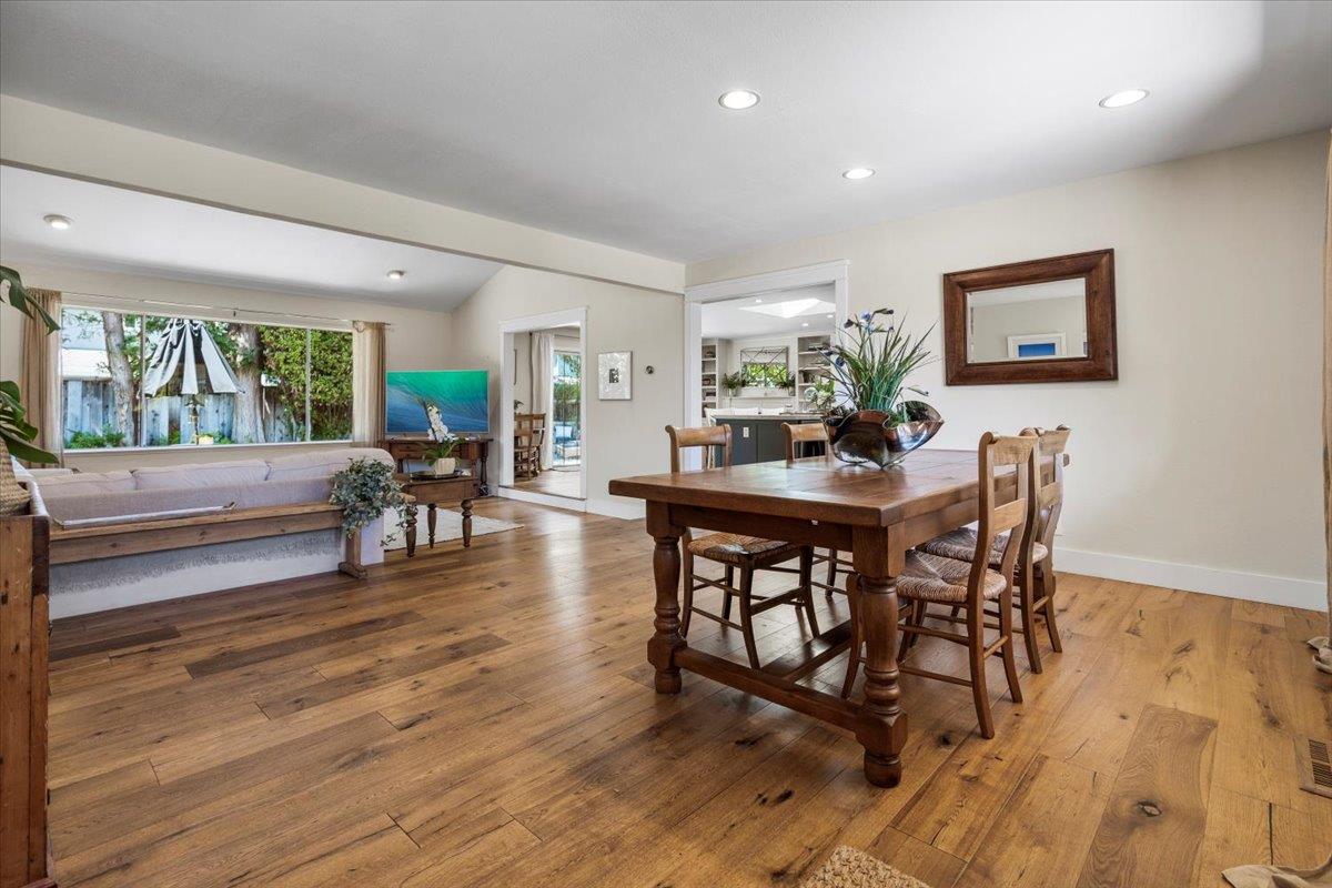 2732 Doverton Square Mountain View, CA 94040 - Photo 6 of 30 a dining room with furniture wooden floor a rug and a painting