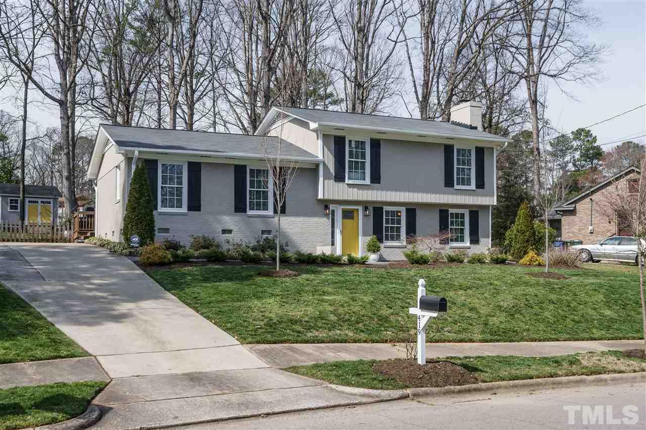 419 East Rowan Street Raleigh, NC 27609 - Photo 1 of 30 a front view of a house with a yard