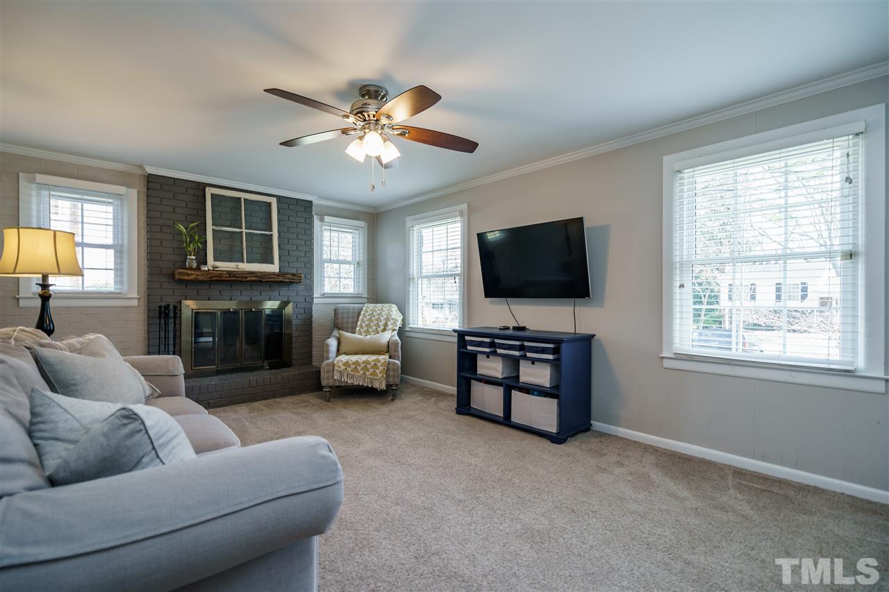 419 East Rowan Street Raleigh, NC 27609 - Photo 14 of 30 a living room with furniture and a flat screen tv