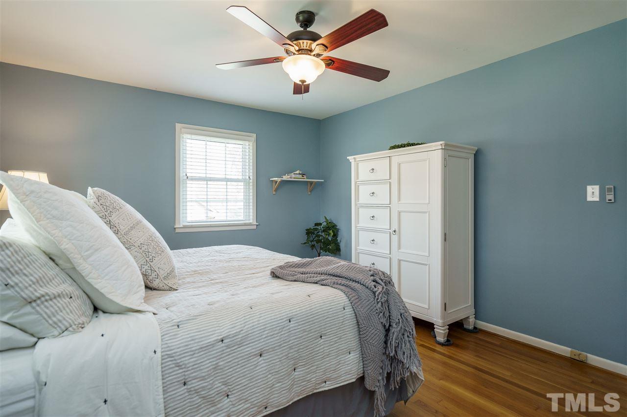 419 East Rowan Street Raleigh, NC 27609 - Photo 17 of 30 a bedroom with a bed and a window