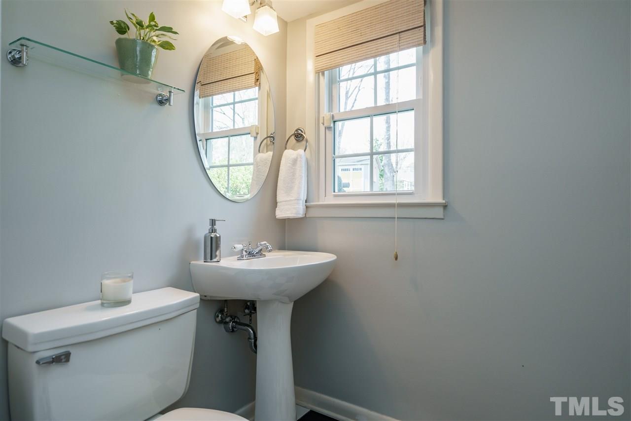 419 East Rowan Street Raleigh, NC 27609 - Photo 23 of 30 a bathroom with a sink toilet and a window