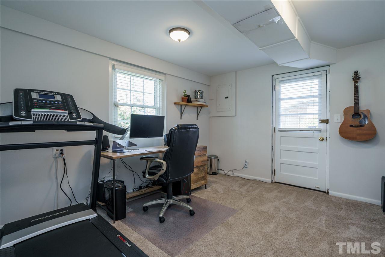 419 East Rowan Street Raleigh, NC 27609 - Photo 24 of 30 a view of a workspace with furniture and a window