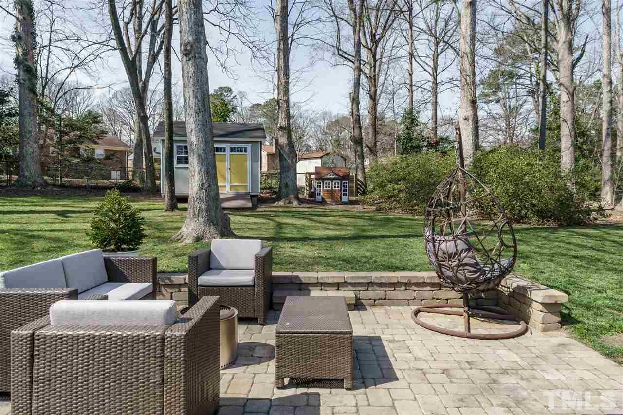 419 East Rowan Street Raleigh, NC 27609 - Photo 26 of 30 a view of a chairs and table in backyard of the house