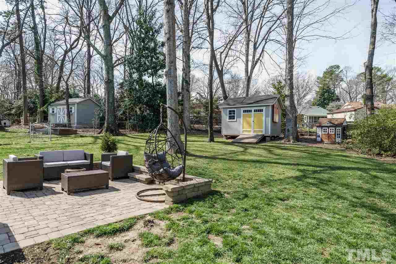 419 East Rowan Street Raleigh, NC 27609 - Photo 27 of 30 a view of a house with backyard sitting area and garden