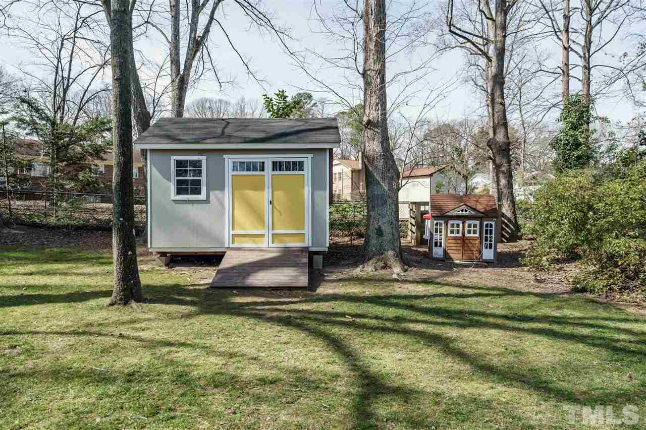 419 East Rowan Street Raleigh, NC 27609 - Photo 28 of 30 a view of a house with swimming pool next to a yard