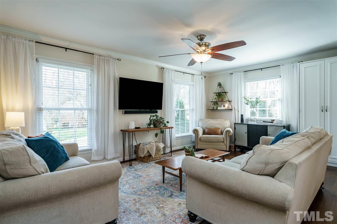 419 East Rowan Street Raleigh, NC 27609 - Photo 4 of 30 a living room with furniture and a flat screen tv