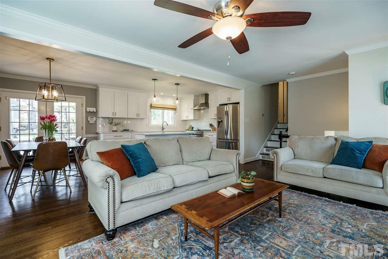 419 East Rowan Street Raleigh, NC 27609 - Photo 6 of 30 a living room with furniture a ceiling fan and a rug