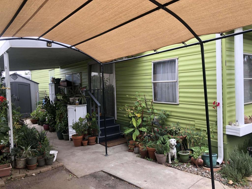 145 East Aviation Road, Unit 22 Fallbrook, CA 92028 - Photo 3 of 7 a view of a chair and table in the patio
