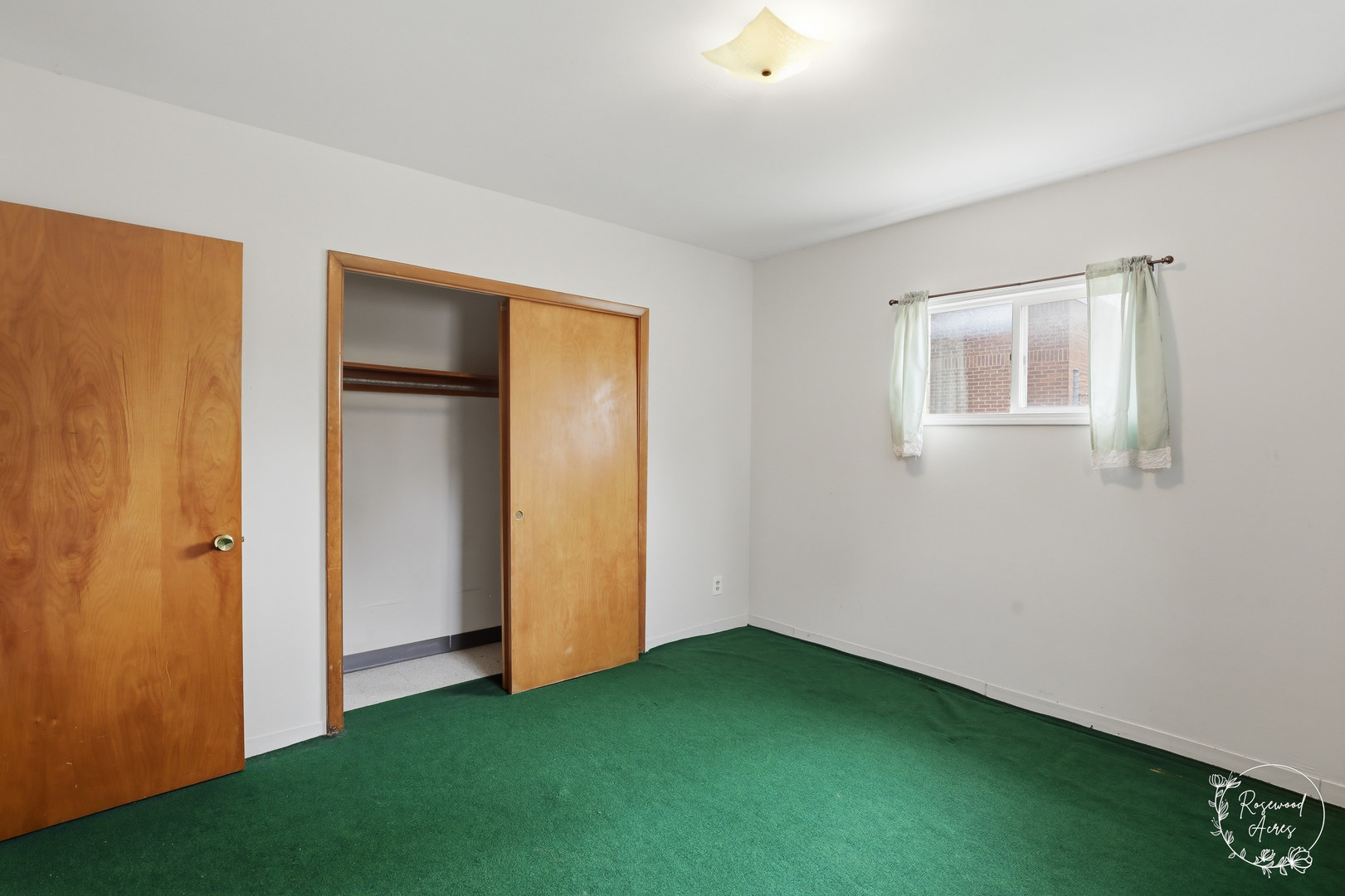 409 Main Street Crescent City, IL 60928 - Photo 16 of 22 a view of an empty room with closet and a window