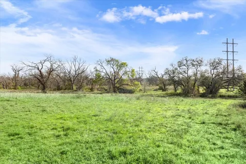 a backyard of a house with lots of green space