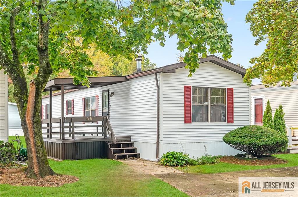 a view of a house with a yard and plants