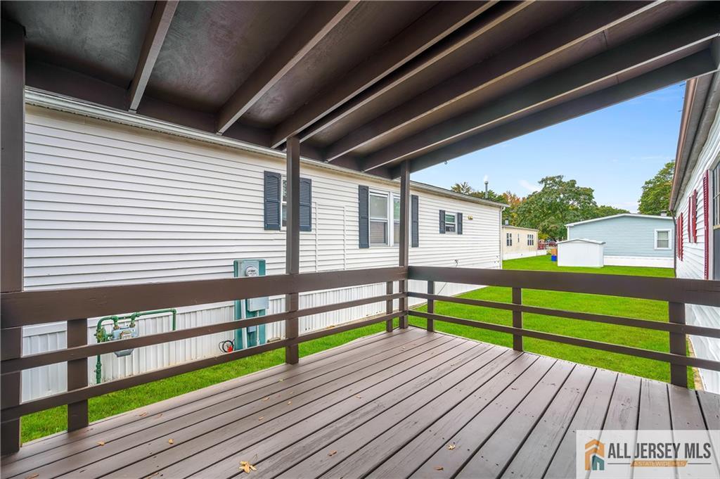 38 Longfellow Road North Brunswick, NJ 08902 - Photo 18 of 23 a view of a terrace with wooden floor and outdoor seating