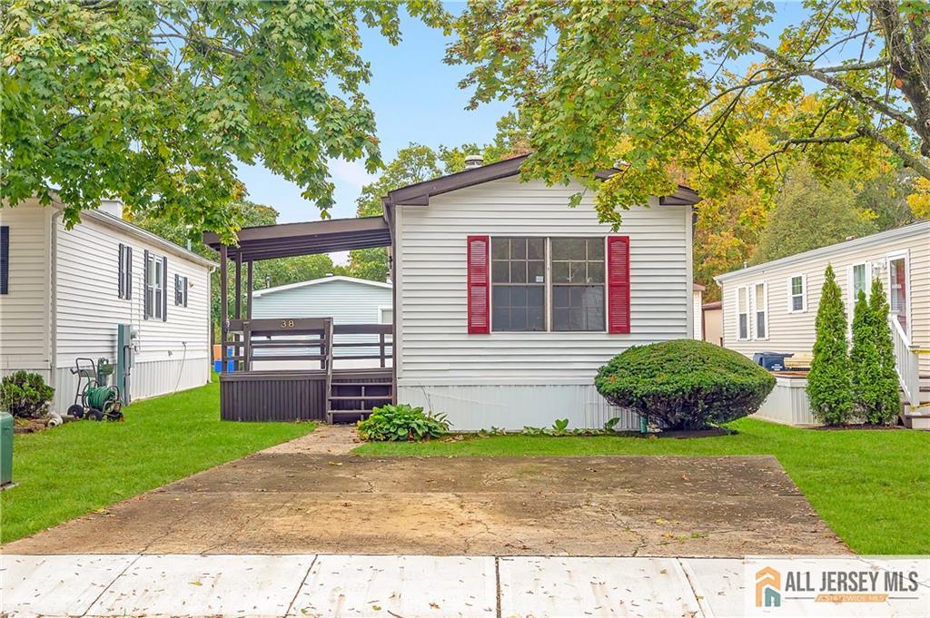 38 Longfellow Road North Brunswick, NJ 08902 - Photo 2 of 23 a front view of a house with a yard and potted plants