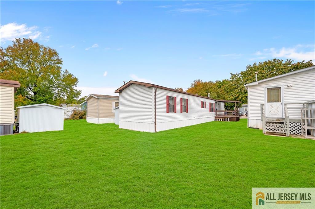 38 Longfellow Road North Brunswick, NJ 08902 - Photo 21 of 23 a view of a backyard with plants and a garden