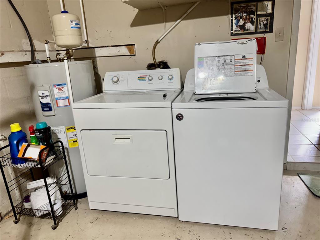 13188 Delbarton Street Spring Hill, FL 34609 - Photo 19 of 23 a utility room with dryer and washer