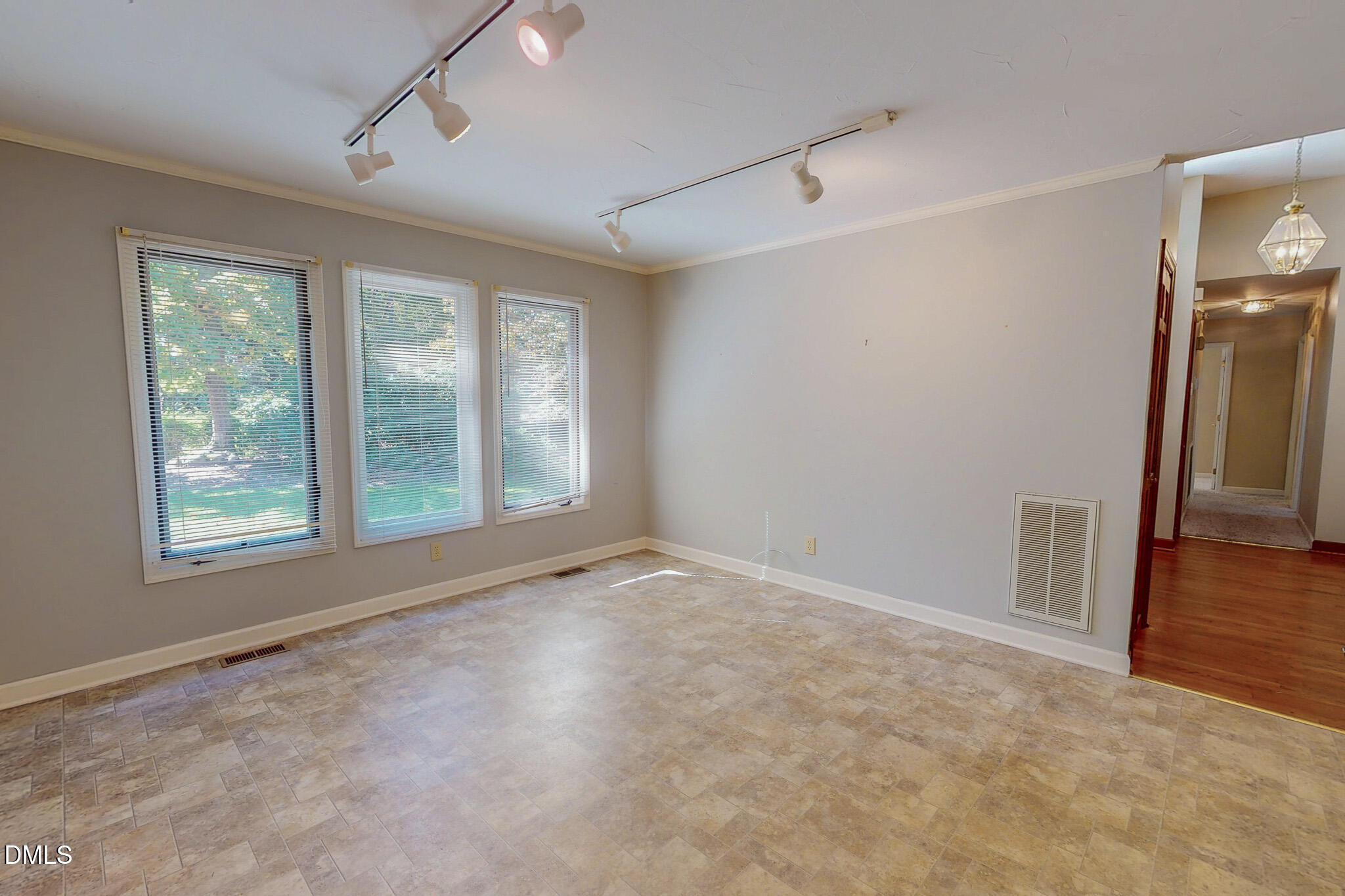 11 Denada Path Roxboro, NC 27574 - Photo 19 of 62 an empty room with a fireplace and wooden floor