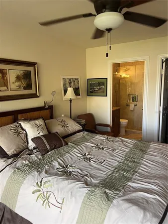 a bedroom with a bed and a lamp