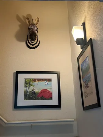 a picture of a rug and a painting on the wall