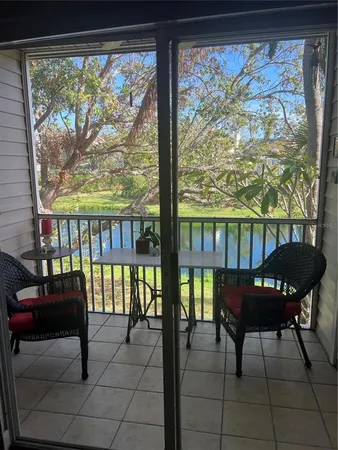 a dining room with furniture window and outdoor view