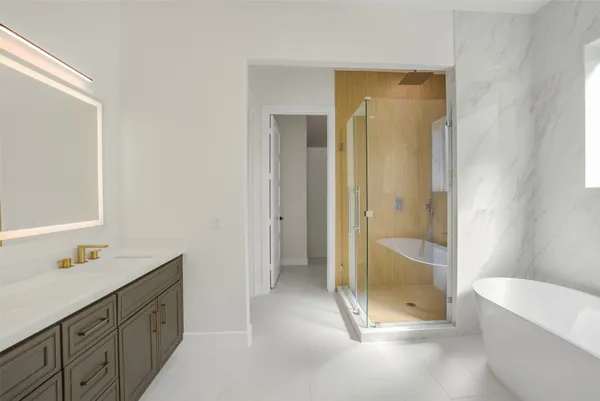 a bathroom with a bathtub and a shower