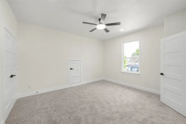 a white bath tub sitting next to a white toilet