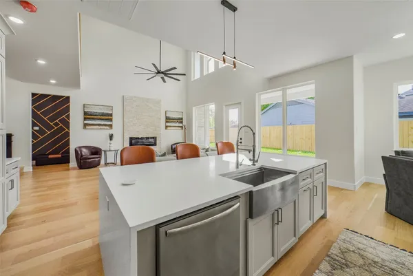 a living room with furniture a table and a large window