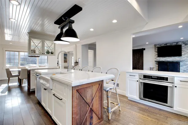 a kitchen with a stove a sink and a refrigerator