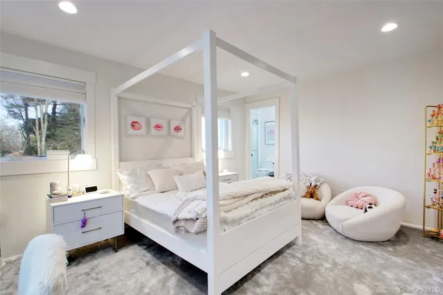 a bed room with a bed and a window