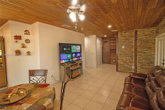 a kitchen with stainless steel appliances granite countertop a refrigerator and a stove