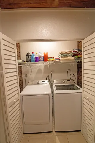 a utility room with a washer and dryer