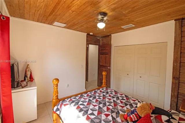 a bathroom with a sink a toilet and shower curtain