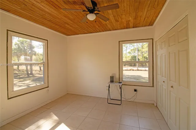 a view of an empty room with a window
