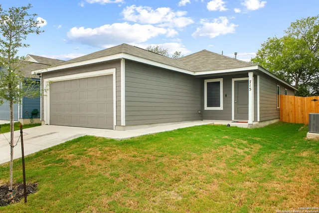 a view of a backyard of the house
