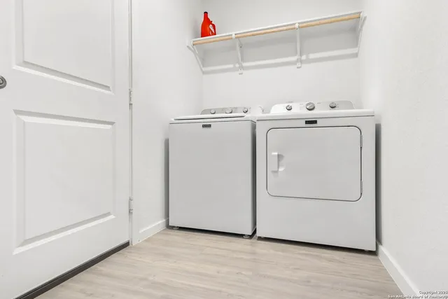 a utility room with dryer and washer
