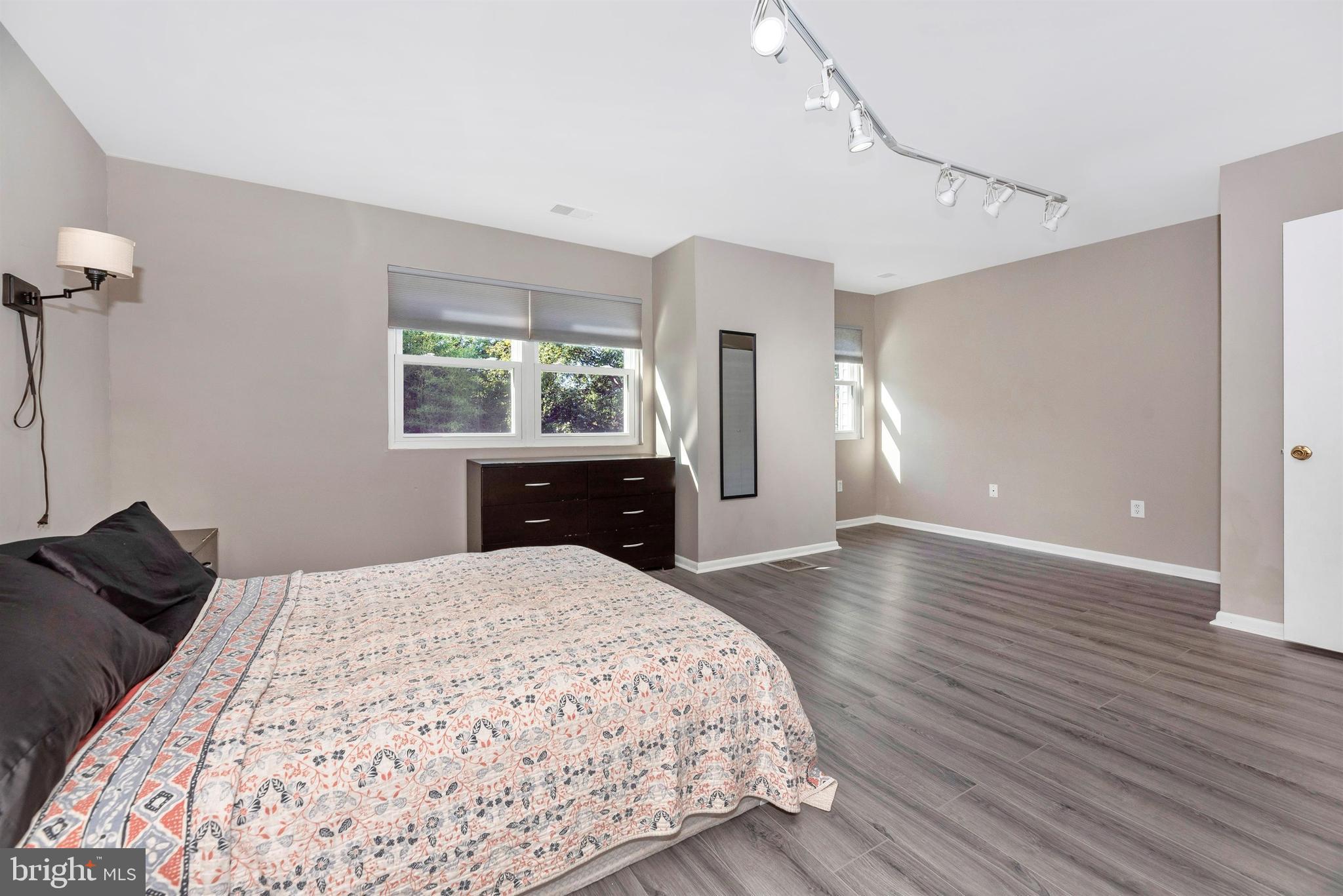 17417 Hoskinson Road Poolesville, MD 20837 - Photo 28 of 45 a bedroom with a bed and a dresser