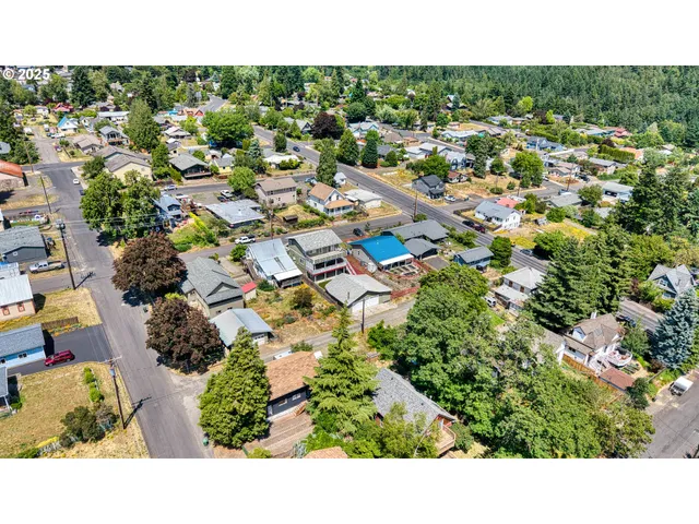 a view of a bedroom with furniture and windows