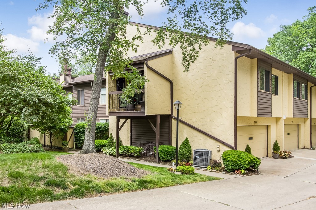 Welcome to 444 Hampton Ridge, the end unit on this beautifully wooded lot.